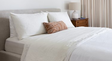 saatva bed with white linen sheets
