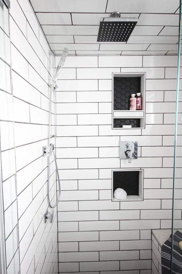 Polished chrome shower system in modern subway tile shower