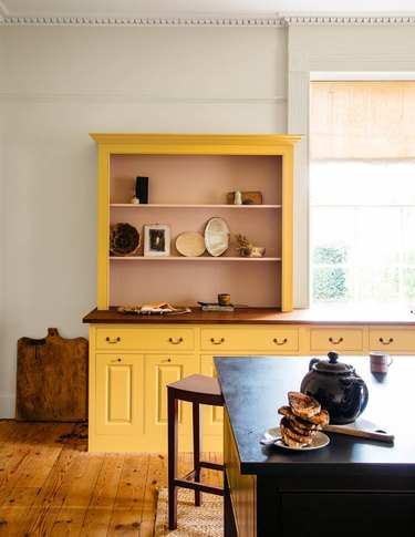 yellow and pink kitchen cabinet