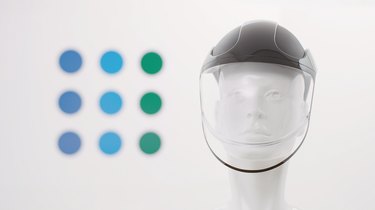 face shield on mannequin with colorful dots in the background
