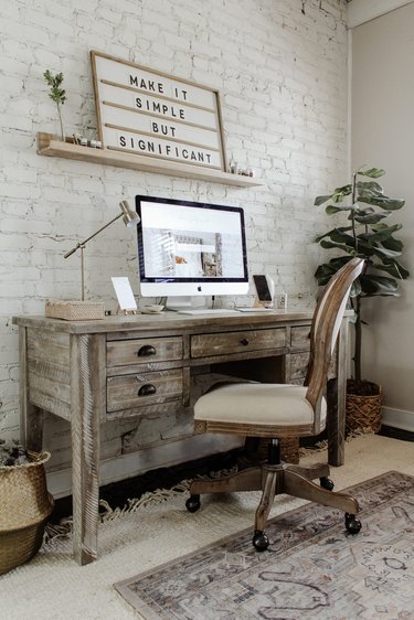 Farmhouse home office with rustic farmhouse desk and office chair