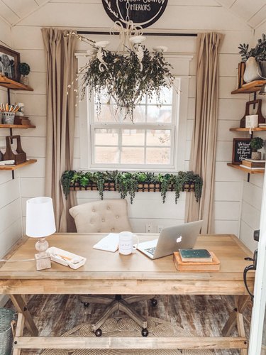 Farmhouse home office in neutral colors with wood desk and shelving