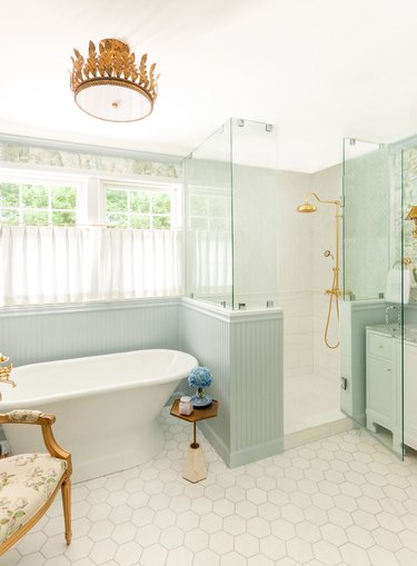 traditional shower fixtures in bathroom with blue tile