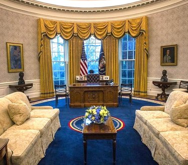 president joe biden's oval office showing resolute desk