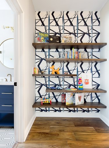 Hanging shelves as hallway storage, designed by Etch Design Group