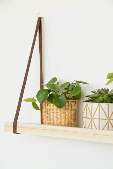 DIY wood and leather hanging plant shelf