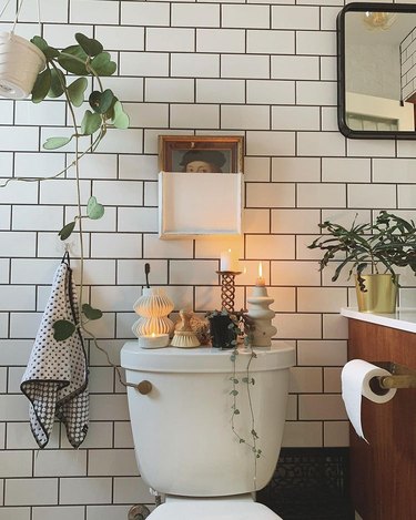 toilet in bathroom styled with candles