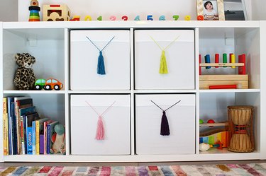 IKEA white boxes with colorful tassels