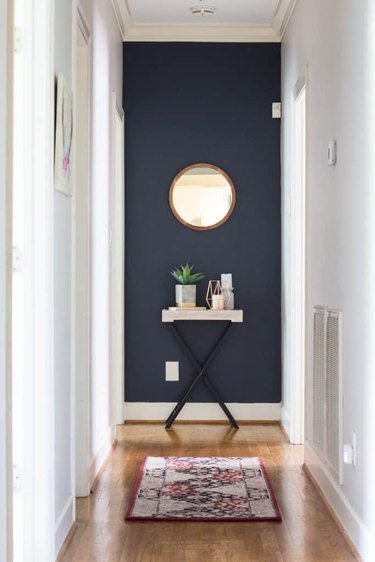 Hallway Focal Point Ideas in white hallway with navy blue feature wall