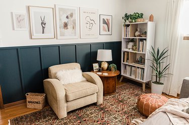 Living room with blue/green board and batten accent wall