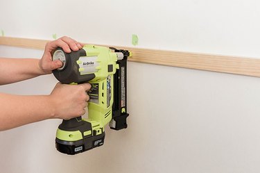 Nail the horizontal slat to the wall.