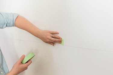 Add painter's tape to clearly mark where the studs are.
