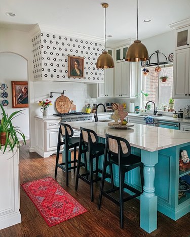 Sarisa Munoz The Indigo Leopard Home kitchen with turquoise island and white cabinets