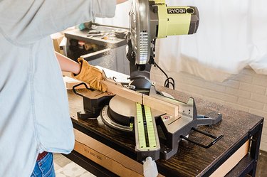 Measure, mark, and cut the vertical slats to size.