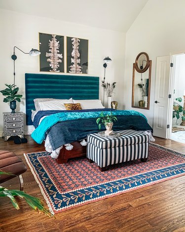 Sarisa Munoz The Indigo Leopard Home bedroom with channel tufted headboard flanked by wall sconces