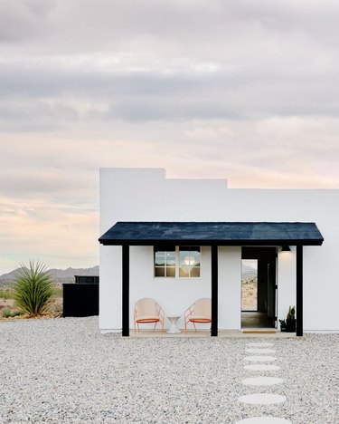 view of a white home in the desert