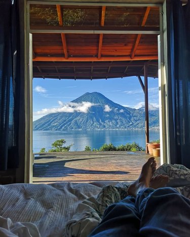 view from a lodge of a volcanic crater and water