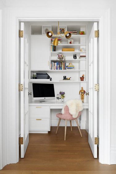 photograph of a desk space with a pink chair