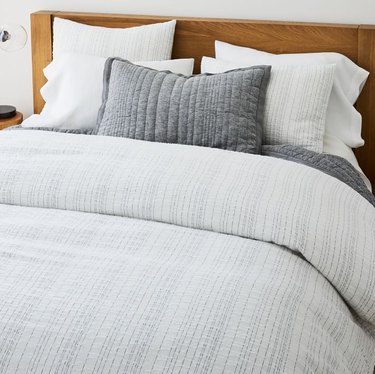 bed with gray bedding
