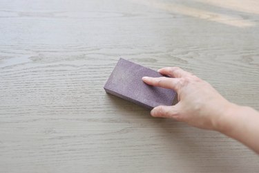 Sanding desk surface with sanding sponge