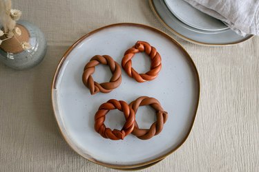 DIY twisted clay napkin rings in terra cotta colors