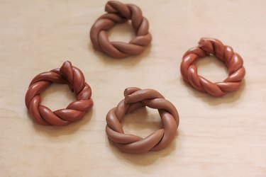 Four DIY twisted clay terra cotta napkin rings