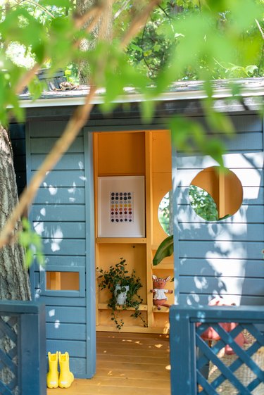 Outdoor playhouse with toy storage