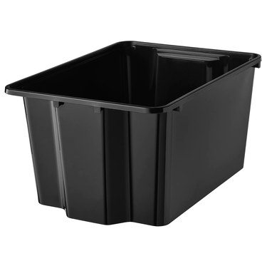 Black plastic storage container on white background