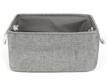 Gray fabric storage container with white rope handles