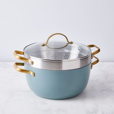 blue ceramic pot with built-in colander and lid