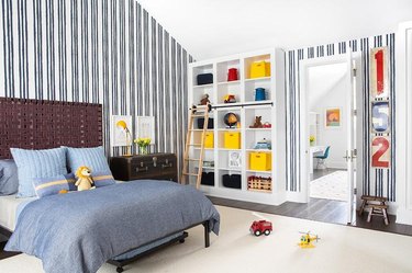 Stuffed Animal Storage in Boy's bedroom with cubbies and organized bins designed by Chango & Co.