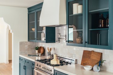 how to clean a stovetop in teal and white kitchen