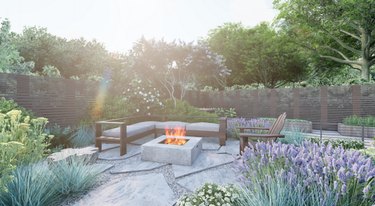Backyard patio area with fire pit and couch