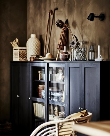black cabinet near brown walls