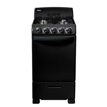 Black small gas stove with knobs and grates