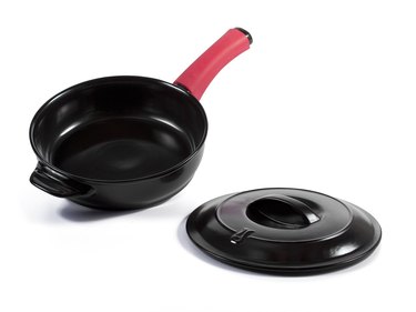 100 percent ceramic cookware in black with red handle and lid