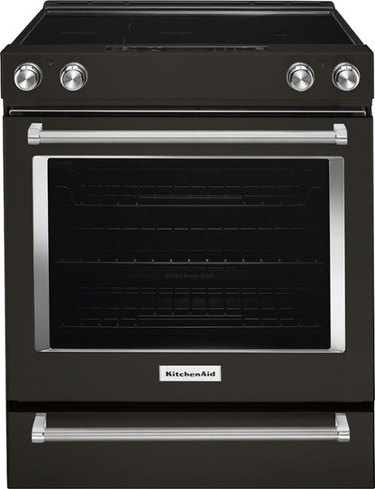 Black glass top electric stove with stainless steel details