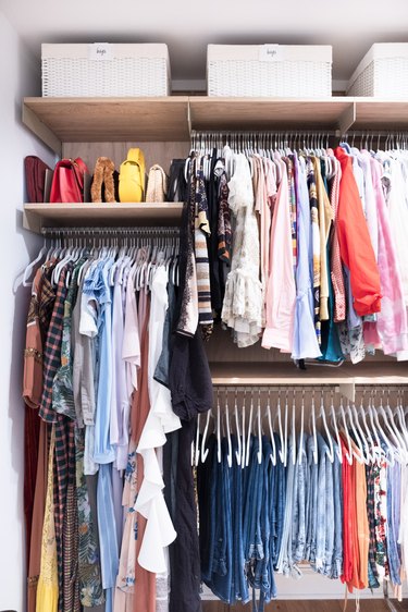 DIY Closet Organizer Ideas in closet with clothes organized by color