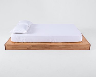 eco-friendly bed frame with bedding on top
