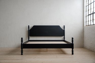 black eco-friendly bed frame in a gray room