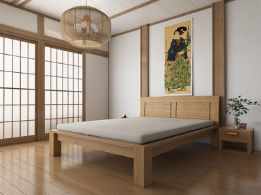Japanese style room with eco-friendly bed frame in the center and art above it