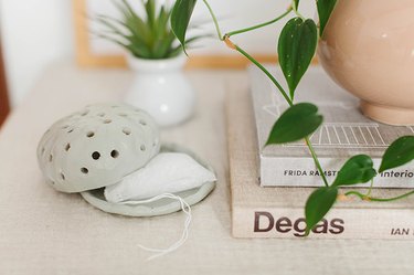 The mint green color of this organic-shaped diffuser gives it style and sophistication.