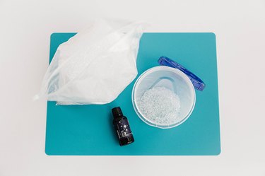 Add essential oil over unscented aroma beads in an airtight container.