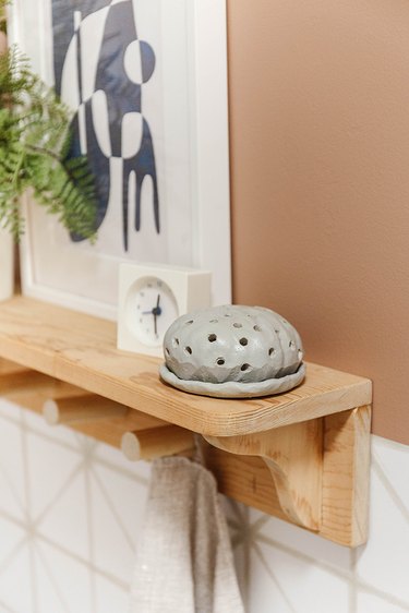 Air-dry clay diffuser on wood shelf