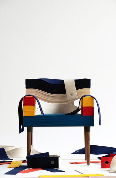 stablack felt arm chair with felt pieces on the floor