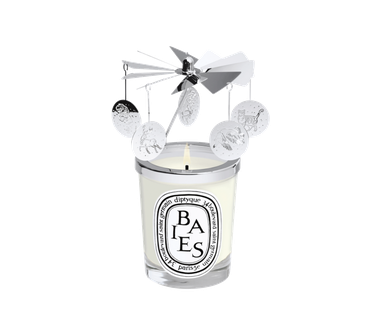 white candle with carousel design on top