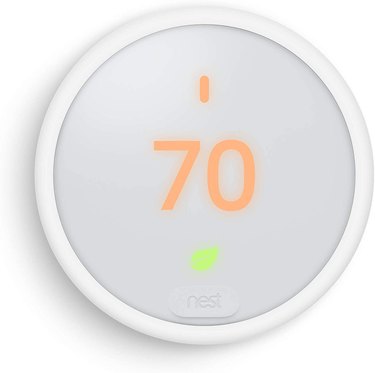 White circular thermostat with touchscreen