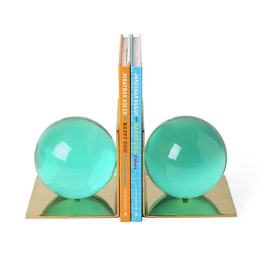 Aquamarine globe bookends with brass backs