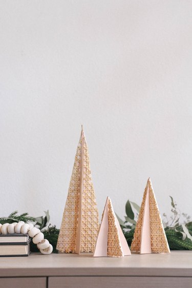 DIY mini wooden holiday trees with cane webbing and leather