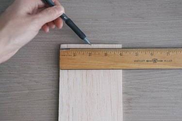 Marking middle of balsa wood with pencil